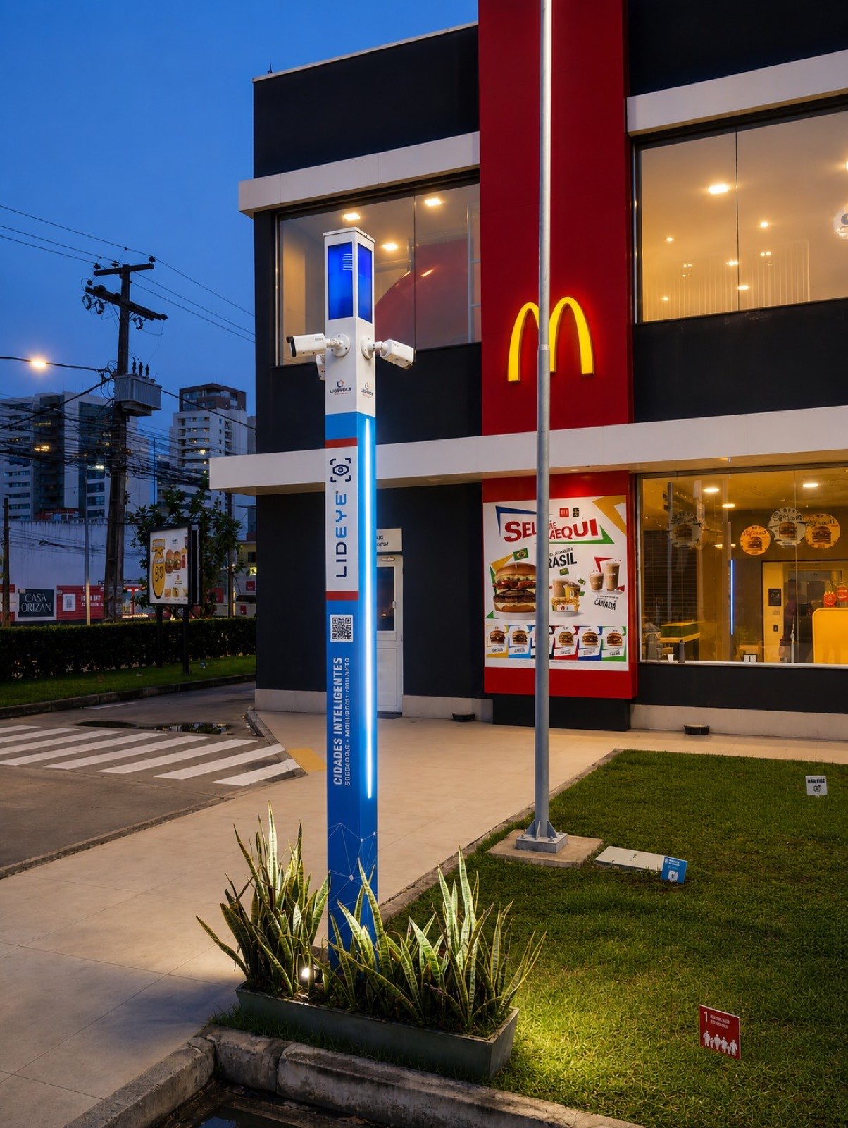 Totem LidEye em frente a restaurante fast-food à noite